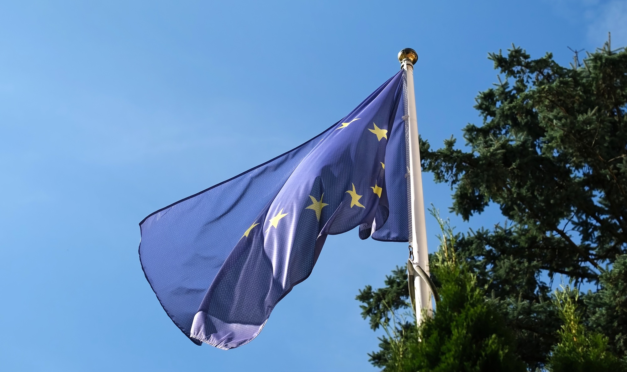 European Union Flag Waving Against Sky Background
