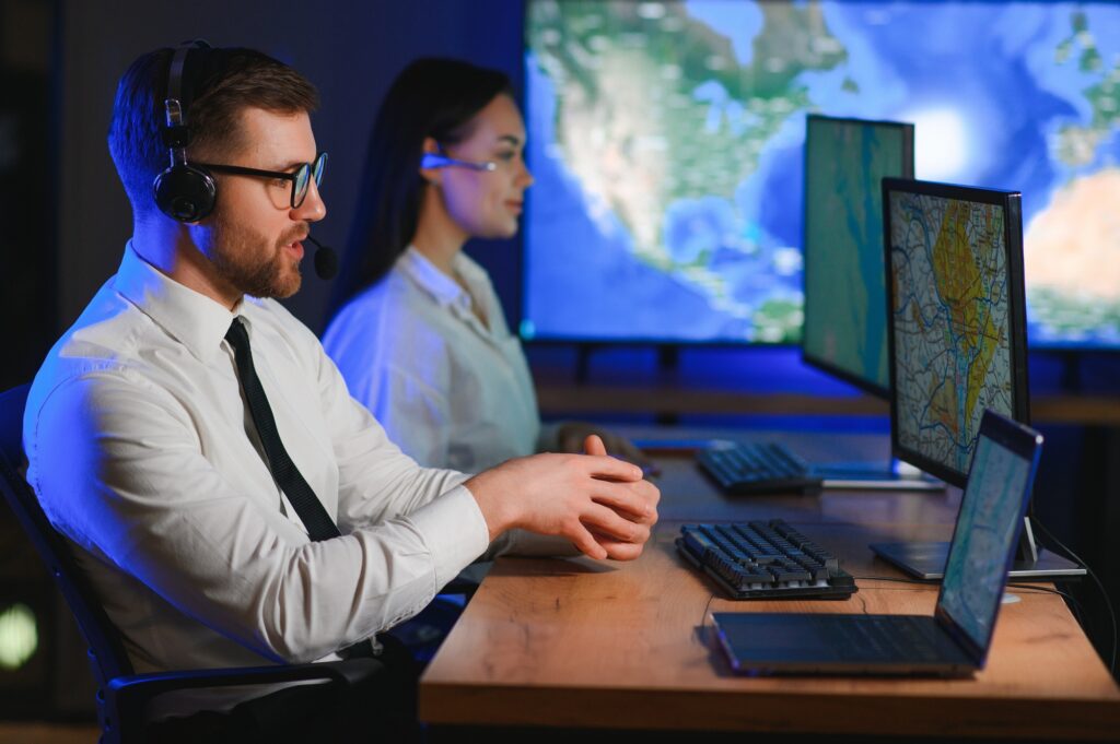 Male Data Scientist Works on Personal Computer Control and Monitoring Room.